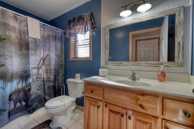 bathroom featuring a shower with shower curtain, vanity, toilet, and tile patterned floors
