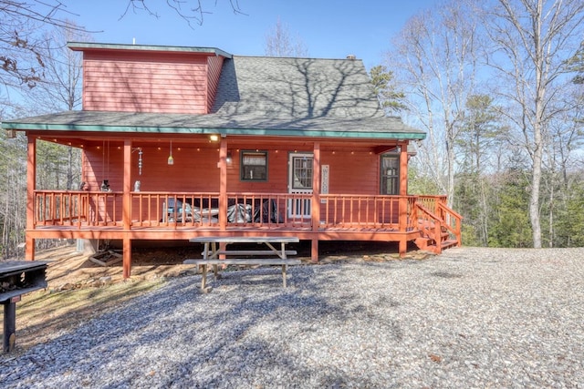 view of front of house featuring roof with shingles