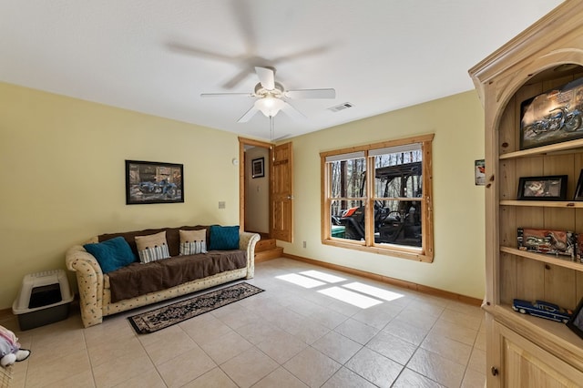 2487 Newport Dr, Ellijay, GA 30540 - living room featuring light tile patterned floors, visible vents, baseboards, and a ceiling fan