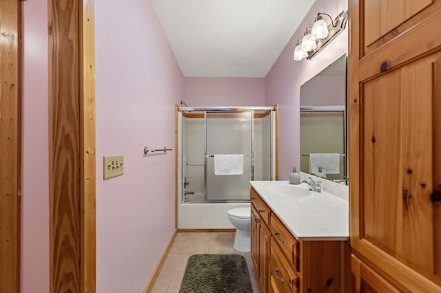 2487 Newport Dr, Ellijay, GA 30540 - bathroom featuring vanity, toilet, bath / shower combo with glass door, tile patterned floors, and baseboards
