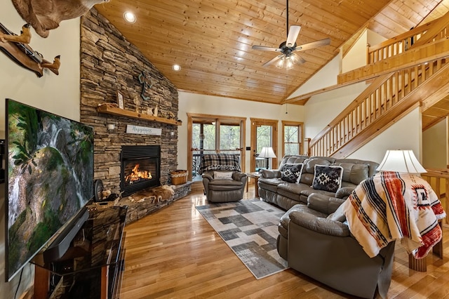 2487 Newport Dr, Ellijay, GA 30540 - living room featuring wood ceiling, wood finished floors, a ceiling fan, and a stone fireplace