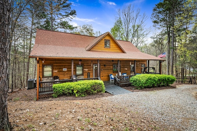 2487 Newport Dr, Ellijay, GA 30540 - rustic home with cooling unit, a shingled roof, and covered porch