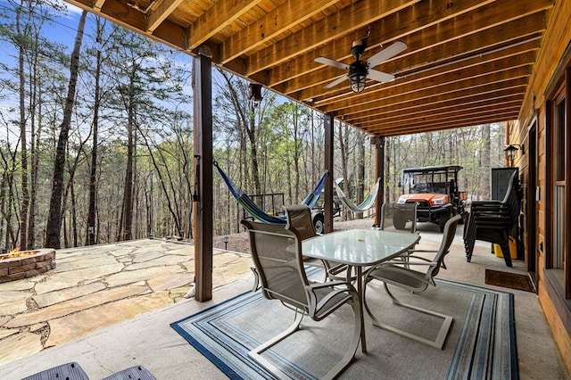 2487 Newport Dr, Ellijay, GA 30540 - view of patio with an outdoor fire pit, outdoor dining space, and ceiling fan