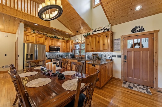 2487 Newport Dr, Ellijay, GA 30540 - dining room with high vaulted ceiling, a notable chandelier, light wood-style floors, and wood ceiling