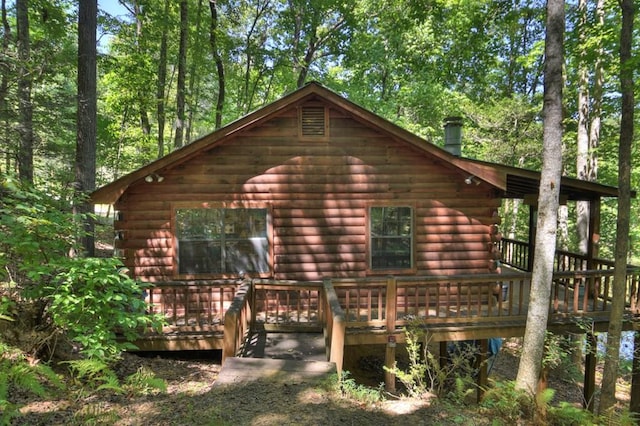 view of property exterior featuring a deck