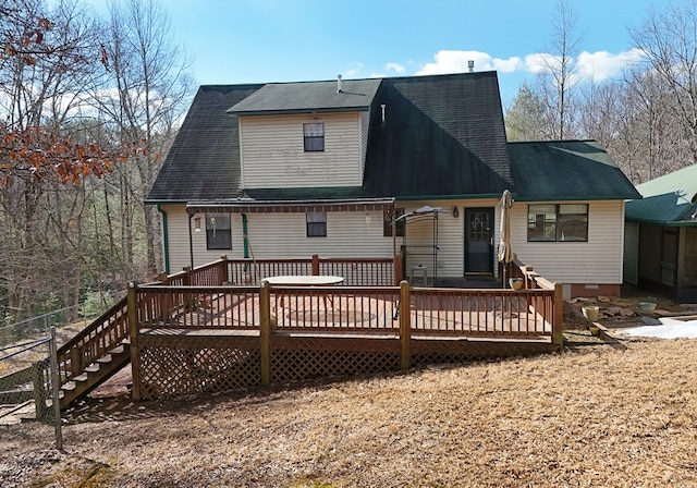 rear view of house with a wooden deck