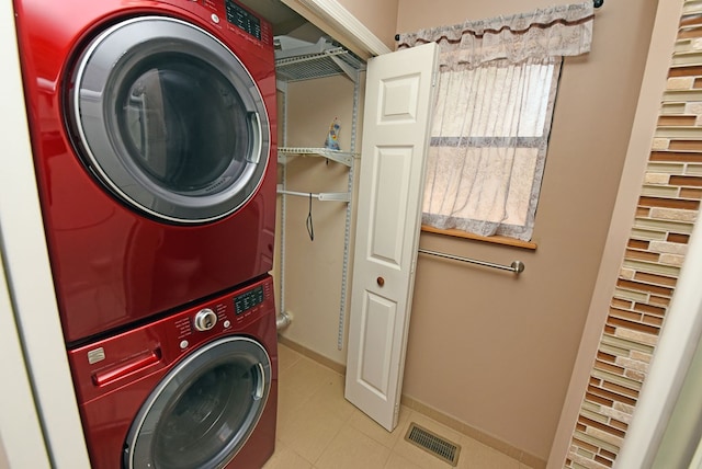 laundry area featuring stacked washer / dryer