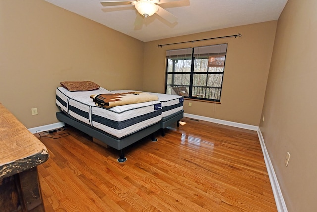 bedroom featuring ceiling fan and wood-type flooring