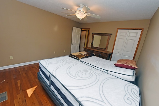 bedroom featuring dark hardwood / wood-style flooring and ceiling fan