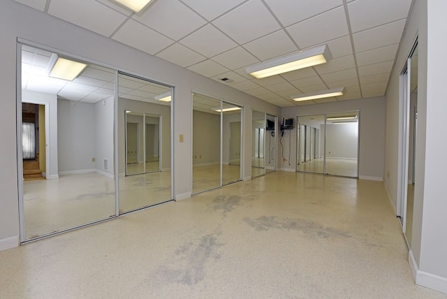 basement featuring a paneled ceiling