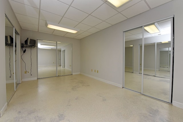 basement featuring a drop ceiling