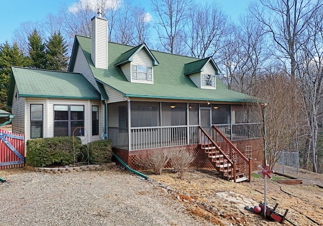 cape cod-style house with a sunroom