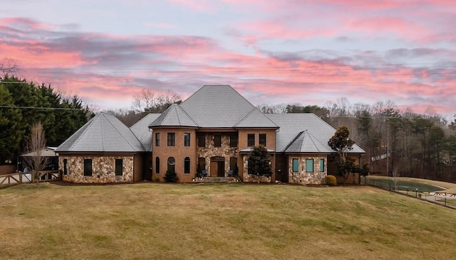 view of front of house with a lawn