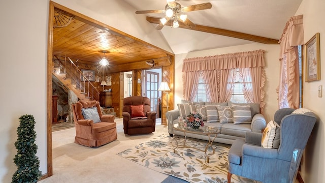 living room featuring ceiling fan, light colored carpet, wood ceiling, and beamed ceiling