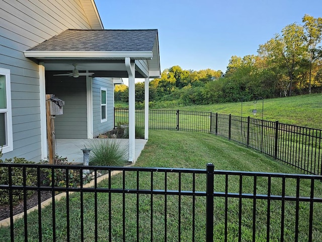 view of yard featuring ceiling fan