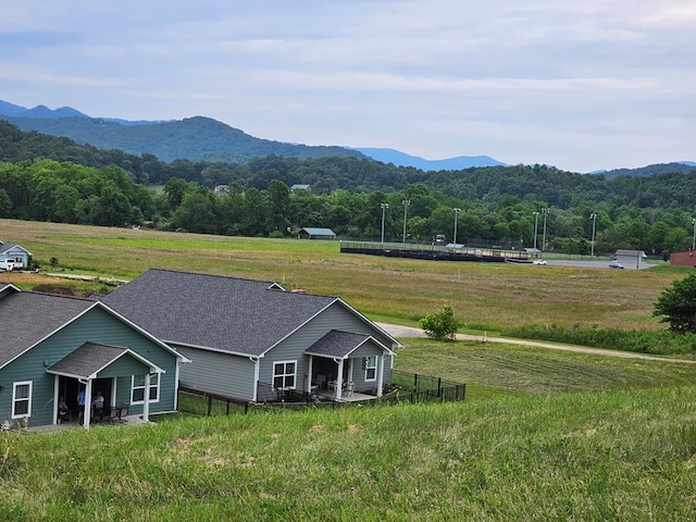 mountain view featuring a rural view