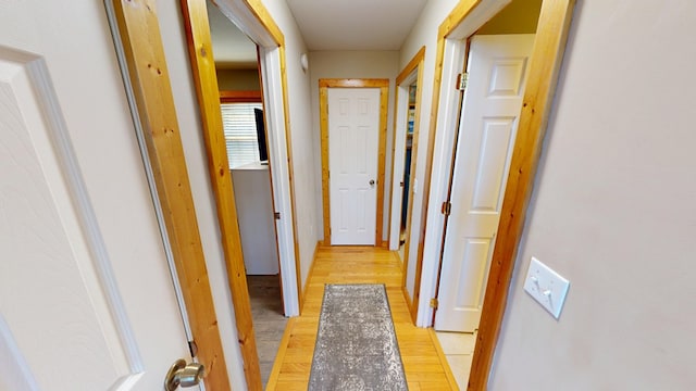 corridor with light wood-style flooring