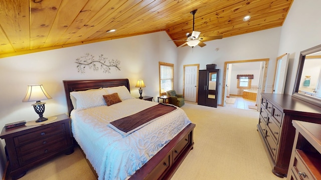 bedroom with wood ceiling, lofted ceiling, ensuite bathroom, light carpet, and a ceiling fan