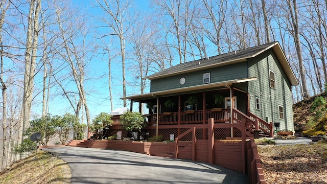 view of front of property with stairs and a porch
