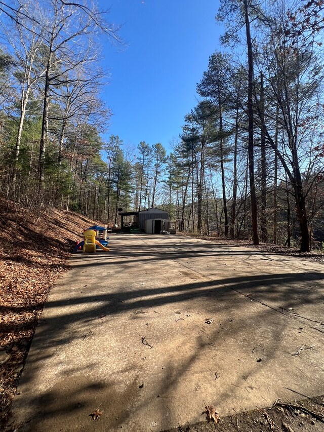 view of street featuring concrete driveway