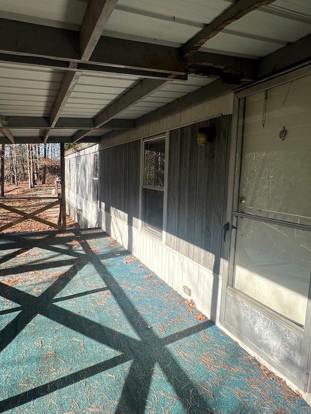 view of patio / terrace with an attached carport