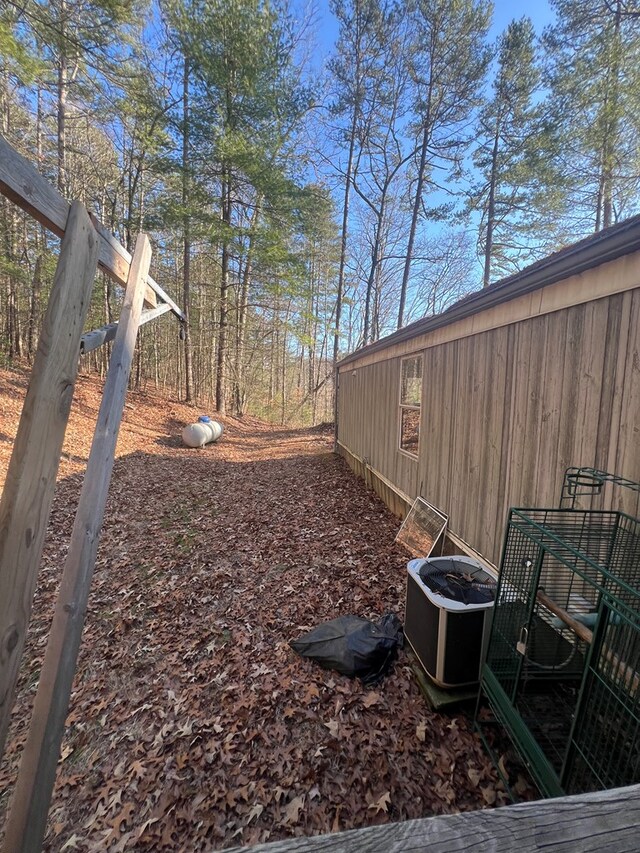 view of yard featuring central air condition unit