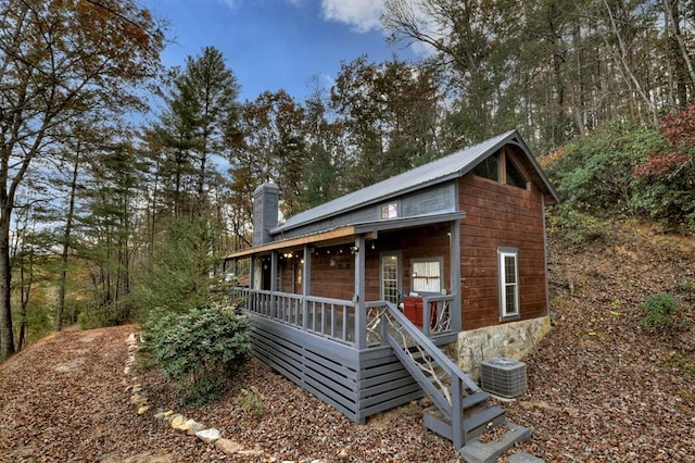 view of front of property with central air condition unit and covered porch