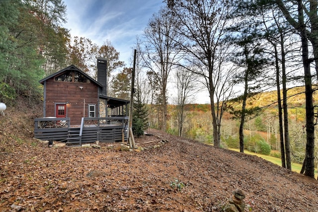 view of yard featuring a wooden deck