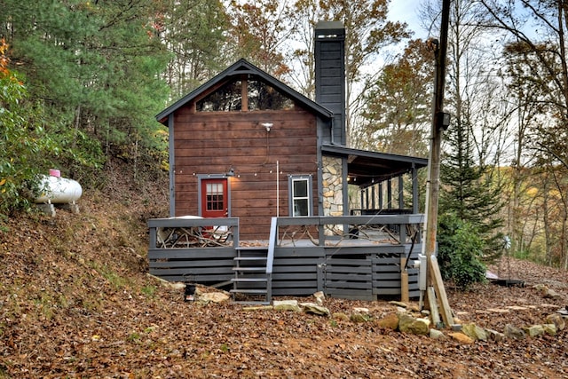 view of side of property with a wooden deck