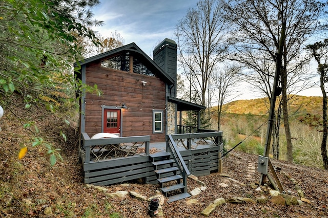 rear view of property featuring a mountain view