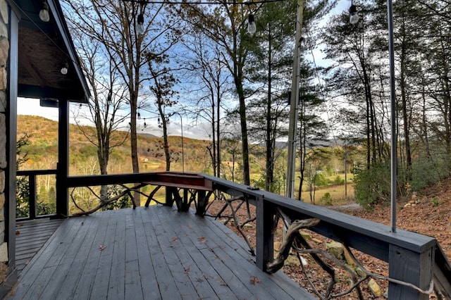 wooden deck featuring a mountain view