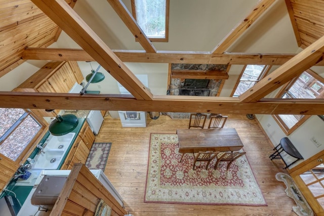 living room featuring hardwood / wood-style floors, a wealth of natural light, and high vaulted ceiling