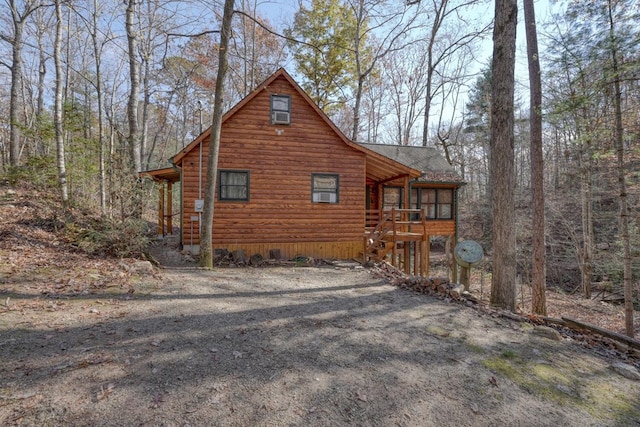 view of side of property featuring a sunroom