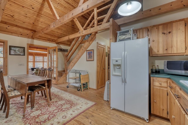 kitchen featuring white fridge with ice dispenser, wooden ceiling, beam ceiling, and light hardwood / wood-style flooring