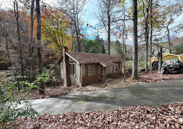 view of home's exterior with a carport