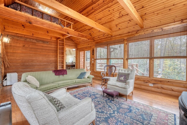 living room with hardwood / wood-style floors, plenty of natural light, lofted ceiling with beams, and wood ceiling