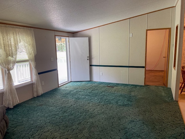1716 Airport Rd, Marble, NC 28905 - unfurnished room featuring a wealth of natural light, a textured ceiling, and crown molding