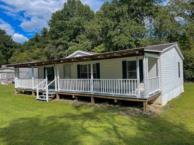 1716 Airport Rd, Marble, NC 28905 - manufactured / mobile home with covered porch and a front yard