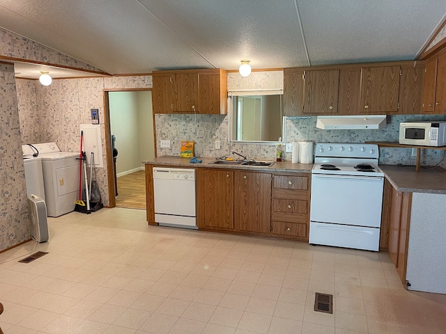 1716 Airport Rd, Marble, NC 28905 - kitchen featuring white appliances, range hood, visible vents, wallpapered walls, and washer and clothes dryer