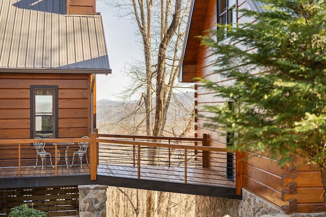 view of side of property with a balcony