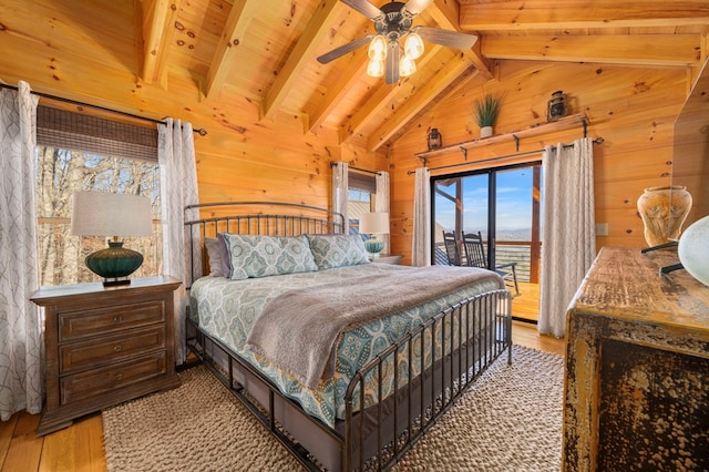 bedroom with wood ceiling, vaulted ceiling with beams, light hardwood / wood-style floors, access to outside, and wood walls