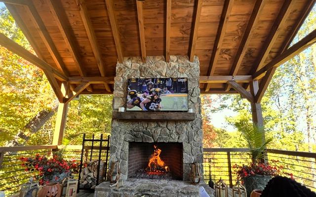 view of patio with an outdoor stone fireplace