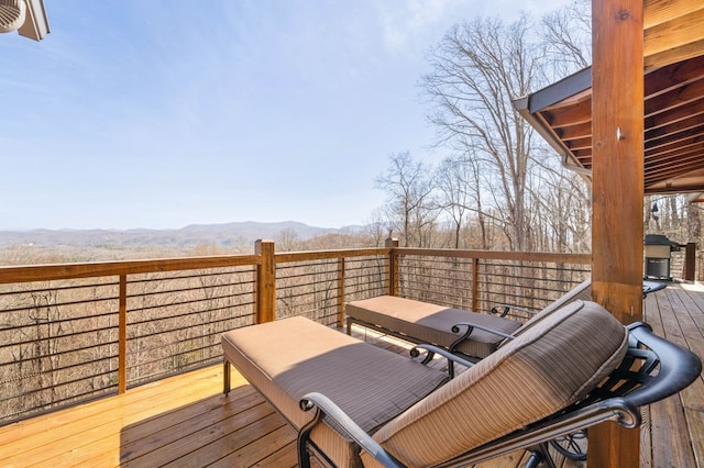 wooden deck with a mountain view