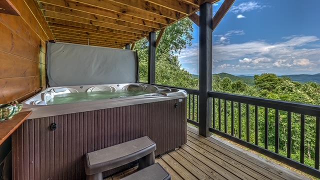 wooden deck with a hot tub