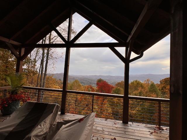 wooden deck featuring a mountain view