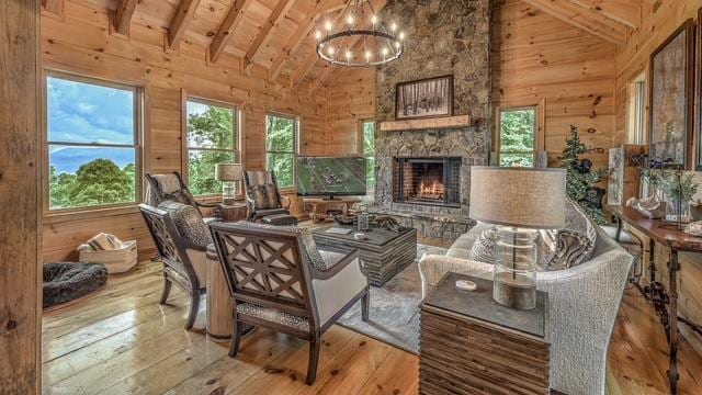 sitting room featuring wood ceiling, wooden walls, and light hardwood / wood-style floors