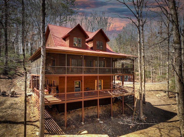 30 Okemah Ct, Ellijay, GA 30540 - rear view of property with a sunroom, metal roof, and a wooden deck