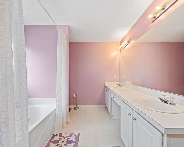 bathroom featuring vanity and a bathing tub