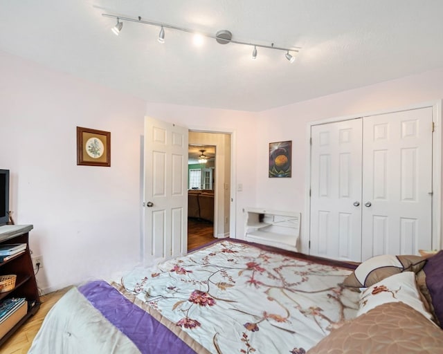 bedroom featuring light hardwood / wood-style floors and a closet