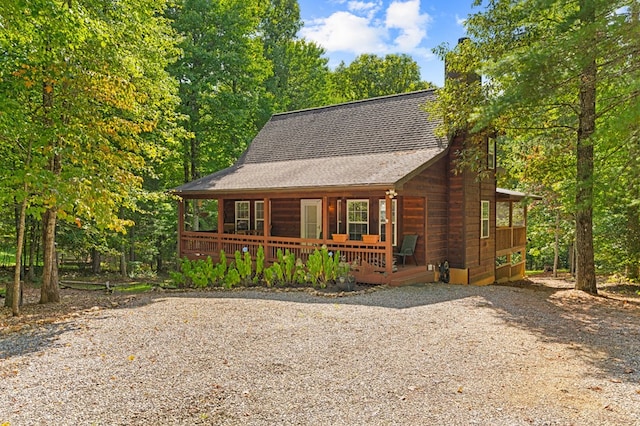 log-style house featuring a porch